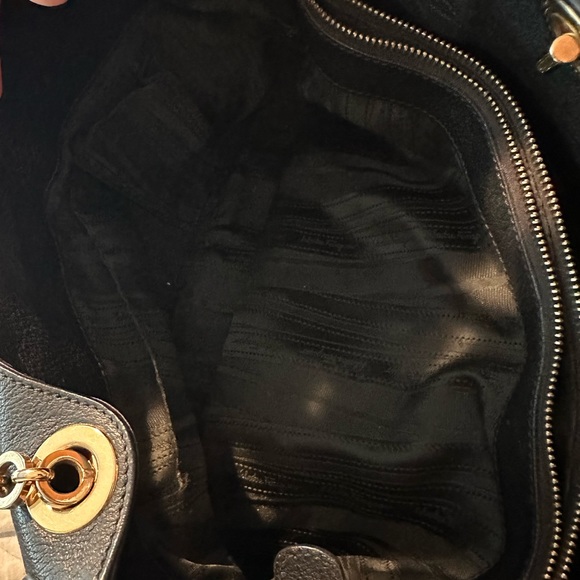 Ferragamo black leather chain metal handbag.